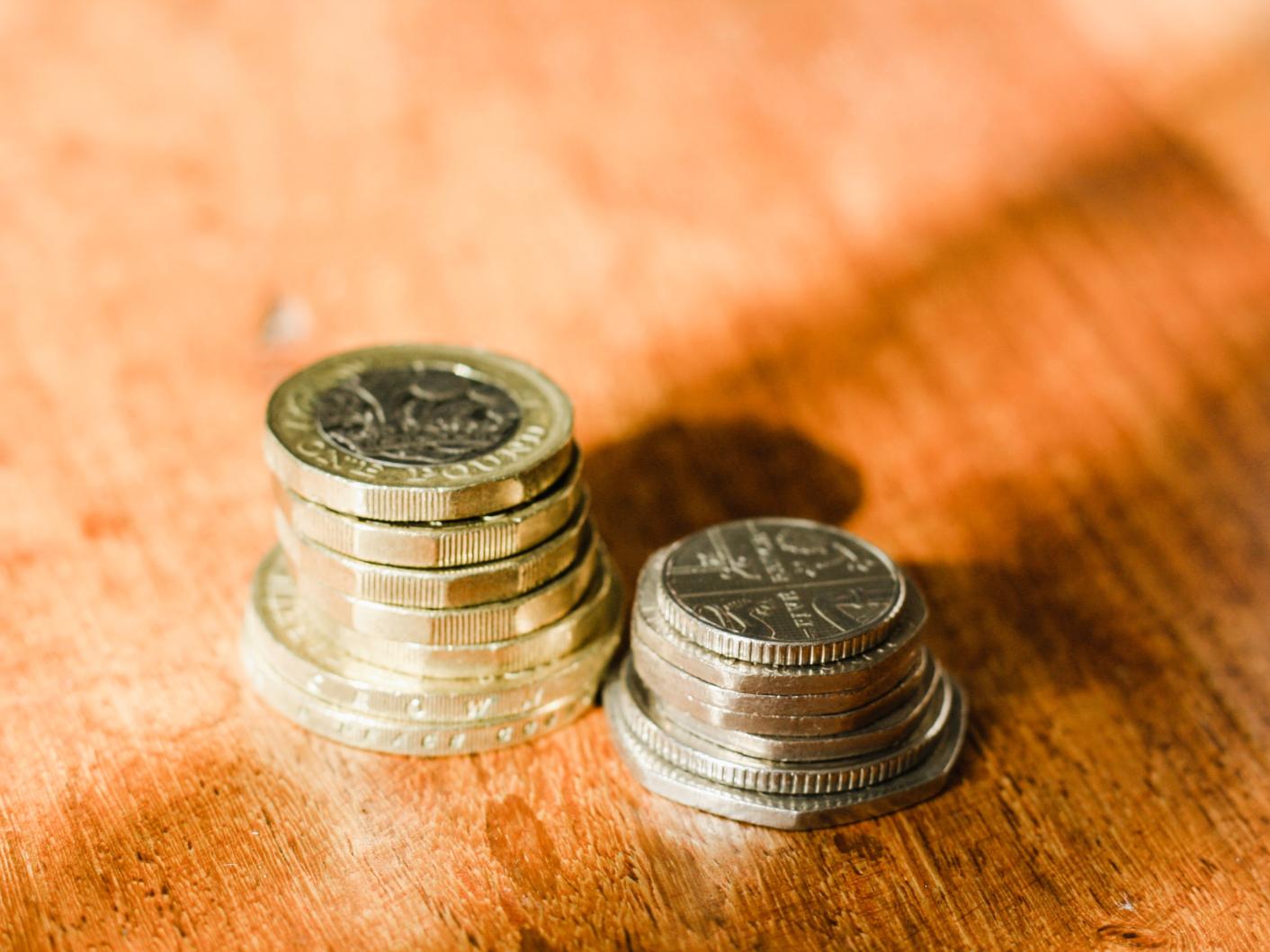 English coins on a wooden table top